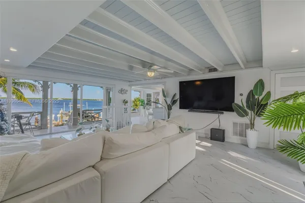 a bathroom with a shower sink and mirror