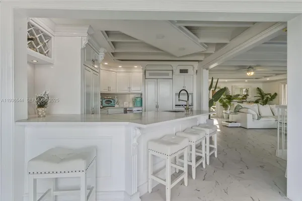 a bathroom with a toilet sink mirror and shower