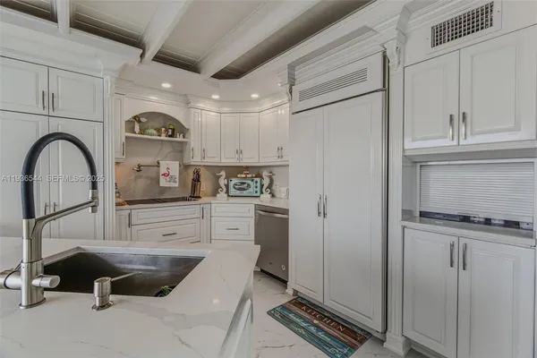 a bathroom with a toilet sink vanity and mirror