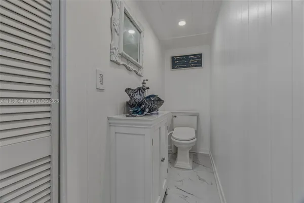 a bedroom with a bed and a chair