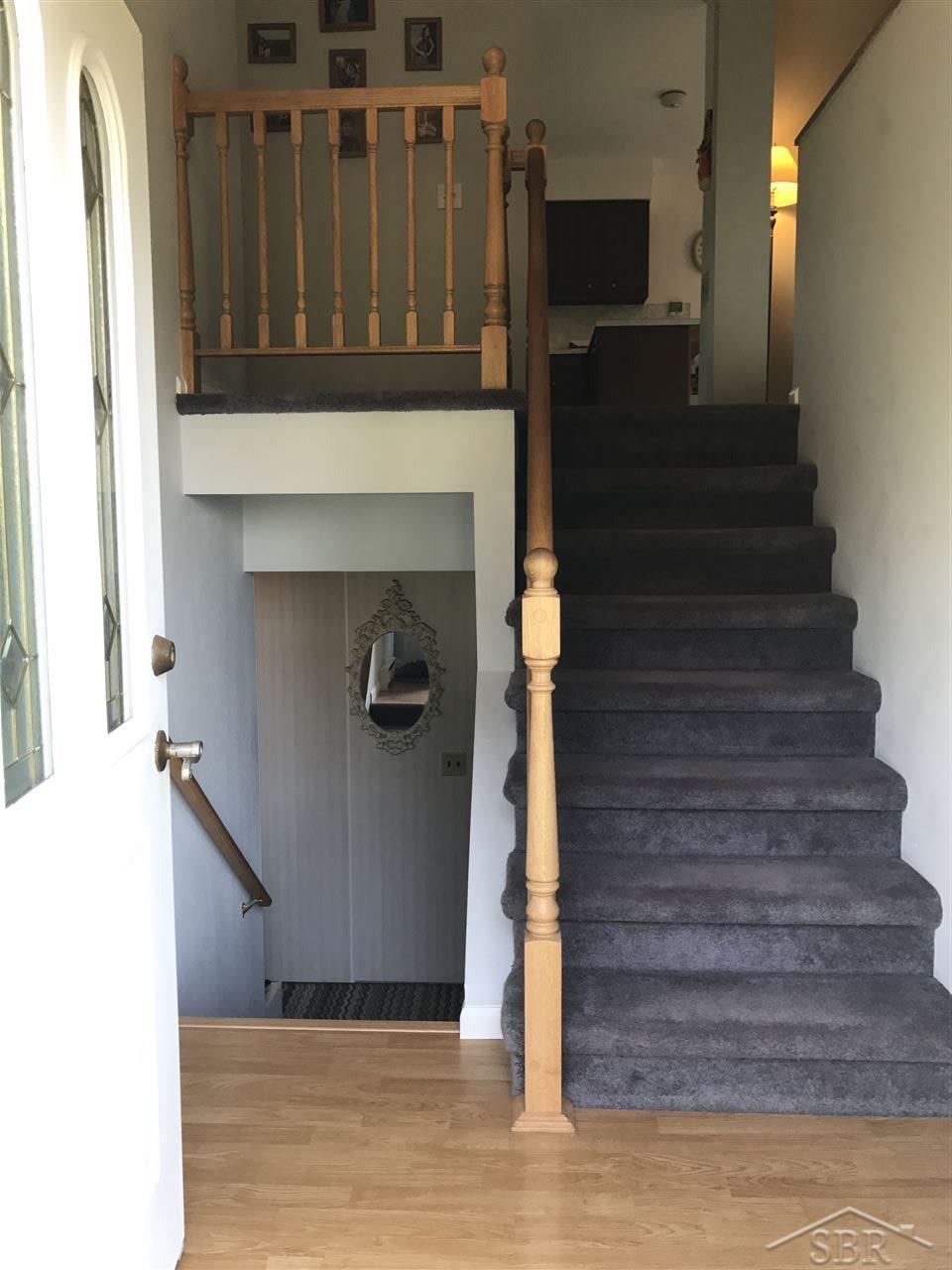 9769 Fulmer Road Millington, MI 48746 - Photo 21 of 29 Staircase w/ Oak Railing