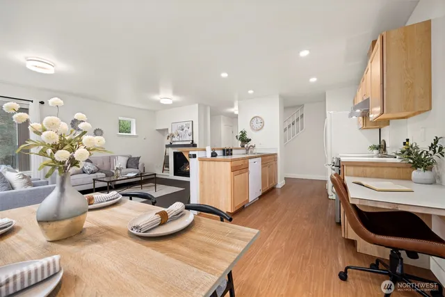 a living room with kitchen island furniture and a wooden floor
