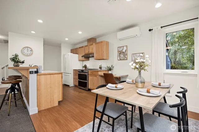a kitchen with a table and chairs in it