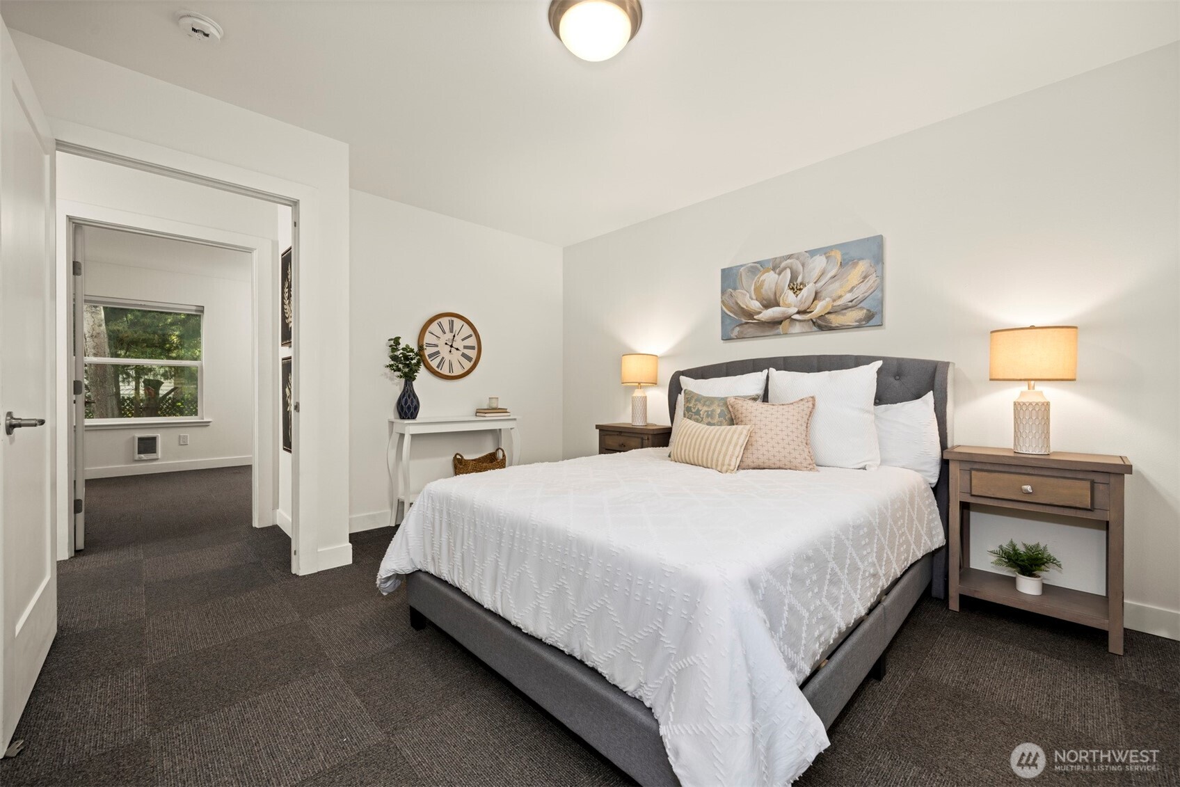 1416 32nd Street Bellingham, WA 98225 - Photo 23 of 37 a bedroom with a bed and a lamp