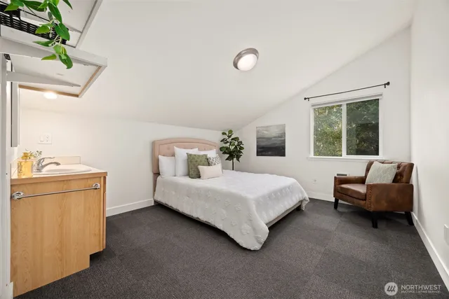 a bedroom with a bed and a couch