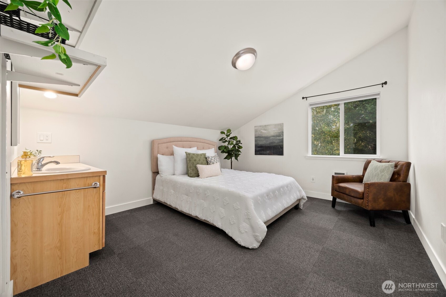 1416 32nd Street Bellingham, WA 98225 - Photo 25 of 37 a bedroom with a bed and a couch