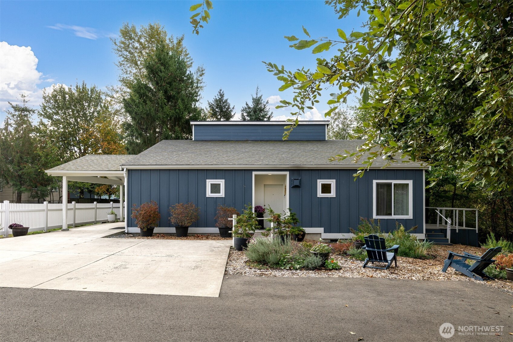 1416 32nd Street Bellingham, WA 98225 - Photo 4 of 37 a front view of a house with a yard and garage