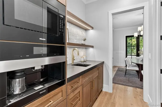 a kitchen with stainless steel appliances granite countertop a stove and a sink