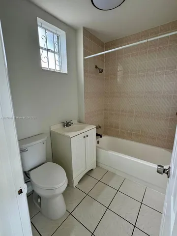 a bathroom with a toilet a sink and a shower