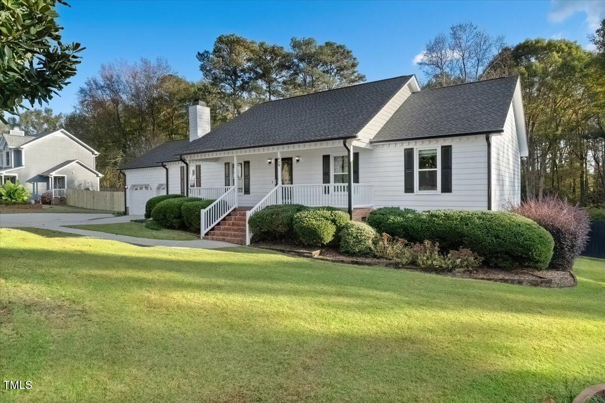 620 Trunecek Circle Raleigh, NC 27603 - Photo 2 of 53 a front view of a house with swimming pool having outdoor seating