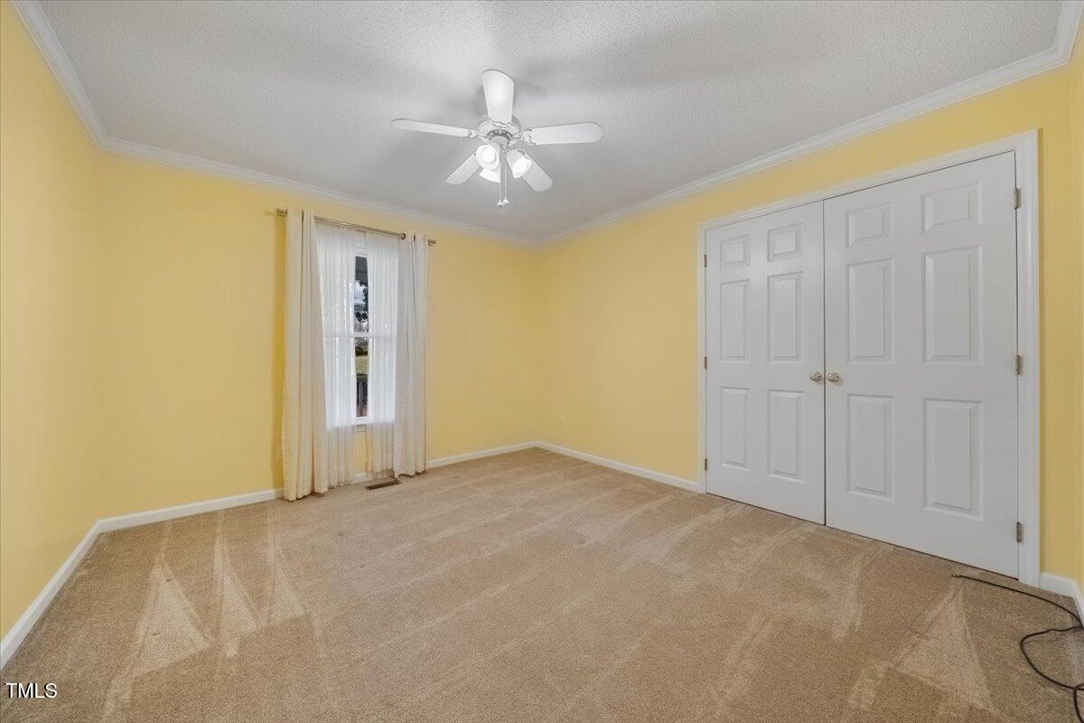 620 Trunecek Circle Raleigh, NC 27603 - Photo 21 of 53 an empty room with closet and fan