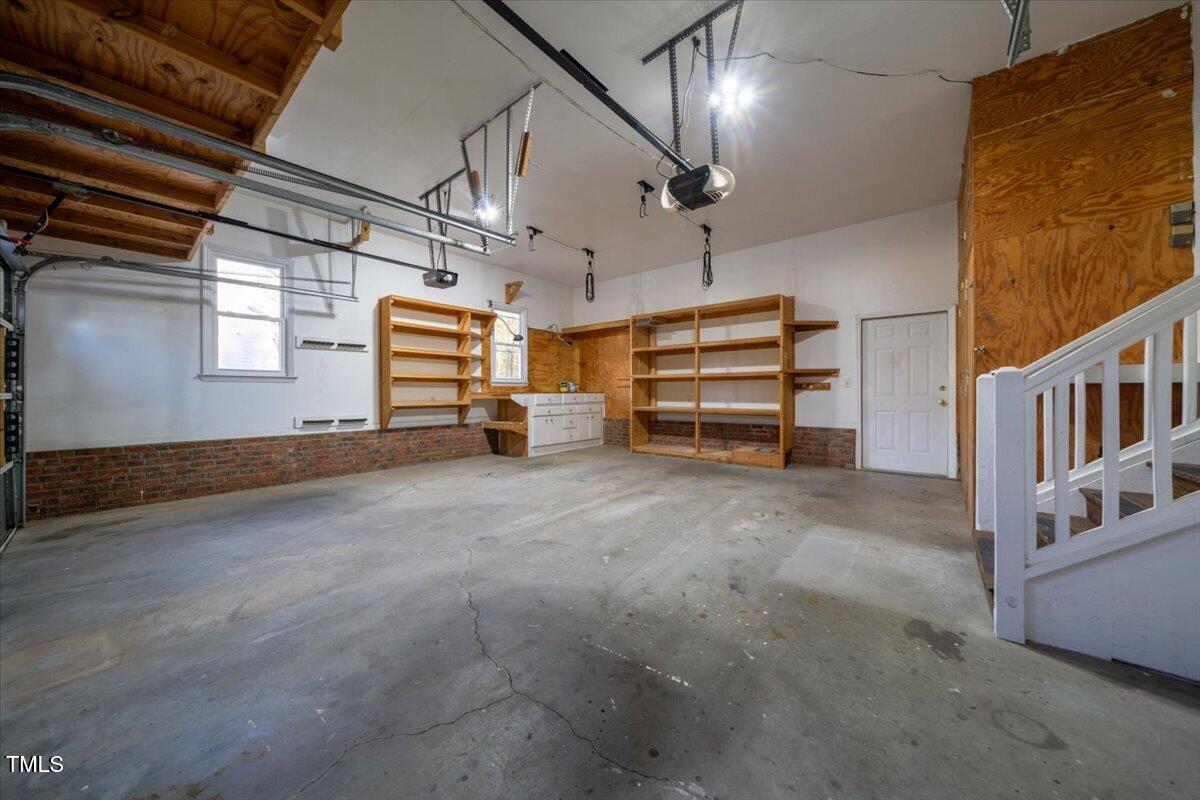 620 Trunecek Circle Raleigh, NC 27603 - Photo 25 of 53 a view of empty room with stairs and mirrors