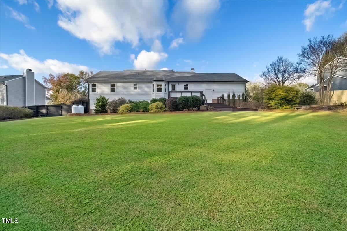 620 Trunecek Circle Raleigh, NC 27603 - Photo 26 of 53 a view of a big house in a big yard with large trees