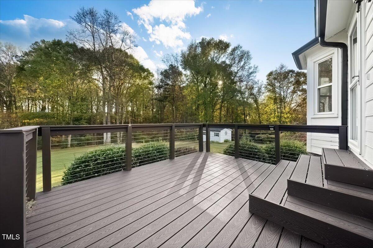 620 Trunecek Circle Raleigh, NC 27603 - Photo 29 of 53 a view of deck with wooden floor and outdoor seating
