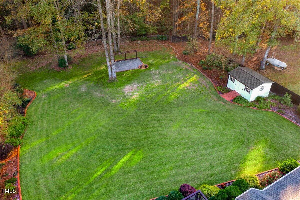 620 Trunecek Circle Raleigh, NC 27603 - Photo 44 of 53 a backyard of a house with table and chairs
