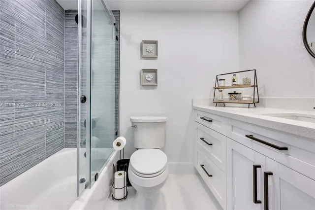 a bathroom with a toilet a sink and bathtub