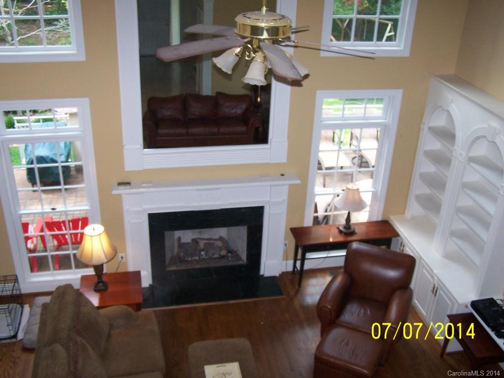 2405 New Salem Road Monroe, NC 28110 - Photo 14 of 20 a living room with furniture a flat screen tv and a fireplace