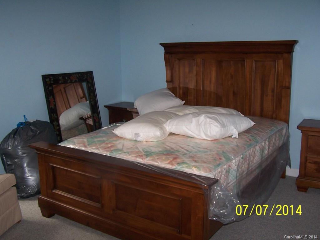 2405 New Salem Road Monroe, NC 28110 - Photo 15 of 20 a bedroom with a bed and a dresser
