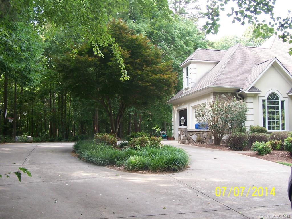 2405 New Salem Road Monroe, NC 28110 - Photo 20 of 20 a view of a house with a yard and table and chairs under an umbrella
