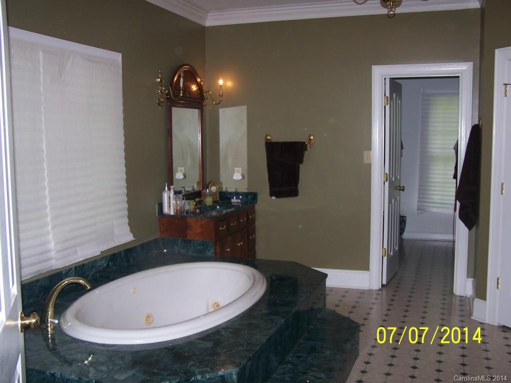 2405 New Salem Road Monroe, NC 28110 - Photo 10 of 20 a bathroom with a sink and a mirror
