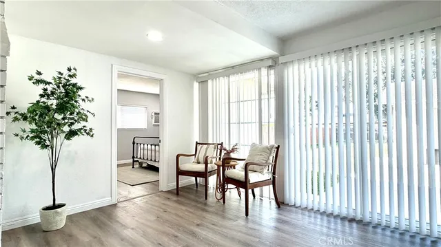 a bedroom with a bed and a potted plant