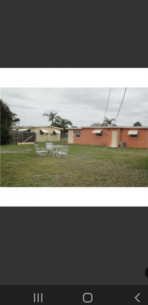 5566 South Rue Road West Palm Beach, FL 33415 - Photo 3 of 10 a black and white photo of a yard
