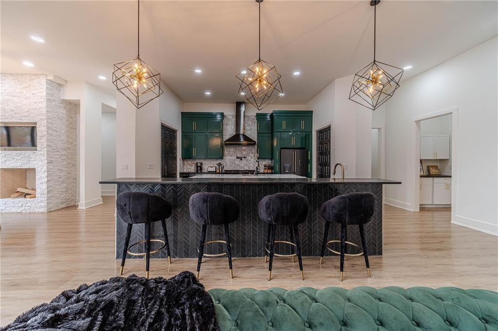 494 River Overlook Road Dawsonville, GA 30534 - Photo 13 of 90 a view of a dining room with furniture and chandelier