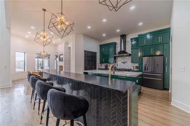 a living room with furniture fireplace and a large window