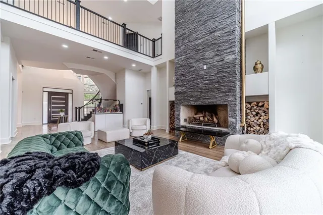 a bed sitting in a spacious bedroom next to a window