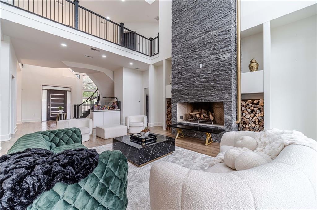 494 River Overlook Road Dawsonville, GA 30534 - Photo 16 of 90 a living room with furniture fireplace and a fireplace