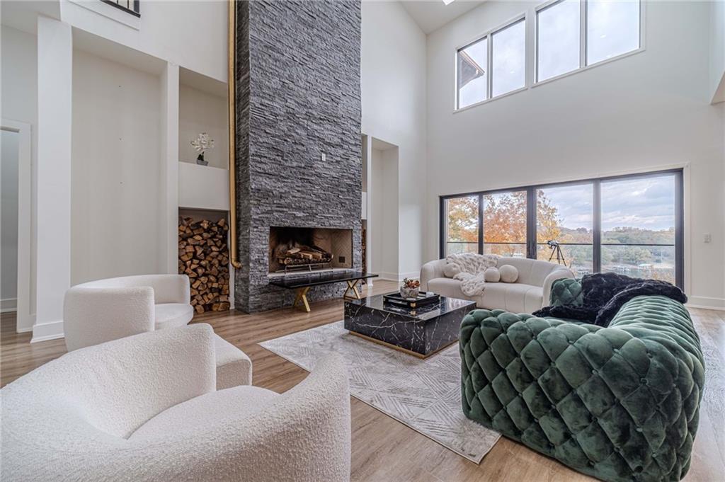 494 River Overlook Road Dawsonville, GA 30534 - Photo 18 of 90 a living room with furniture and a fireplace