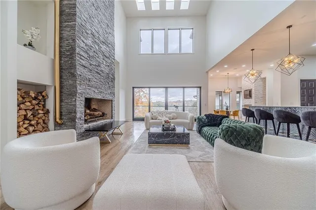 a spacious bedroom with a bed and a large window