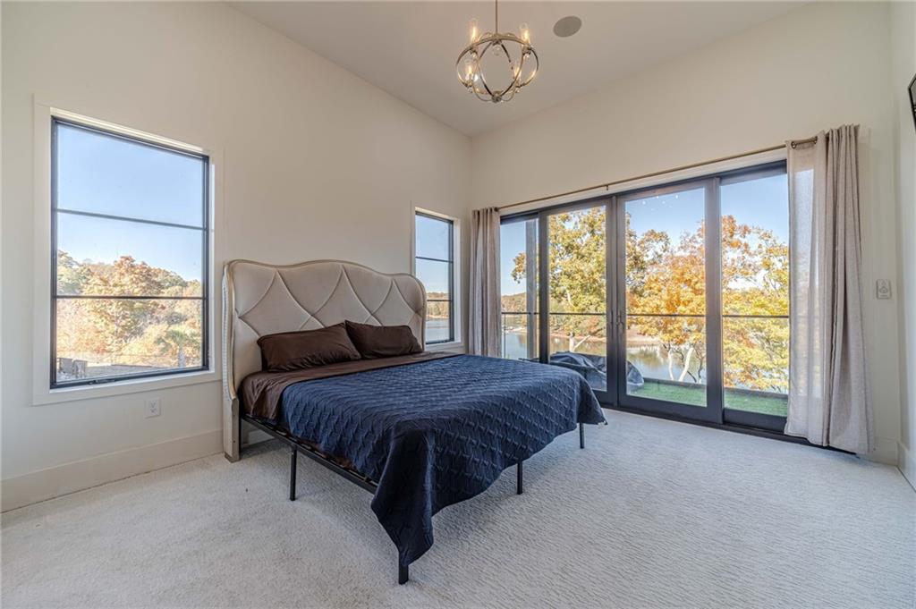 494 River Overlook Road Dawsonville, GA 30534 - Photo 20 of 90 a bed sitting in a room next to a window