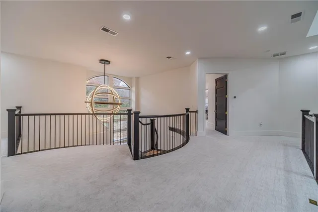 a bathroom with a granite countertop sink mirror vanity and toilet