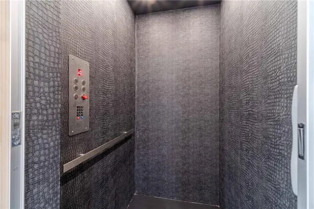 a view of entryway with wooden floor and staircase