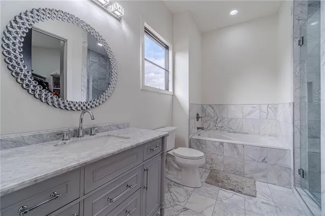 a view of a house with an empty space and a garage