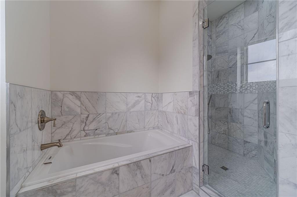 494 River Overlook Road Dawsonville, GA 30534 - Photo 46 of 90 a bathroom with a shower and a bathtub