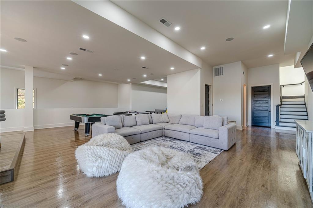 494 River Overlook Road Dawsonville, GA 30534 - Photo 52 of 90 a living room with furniture and wooden floor