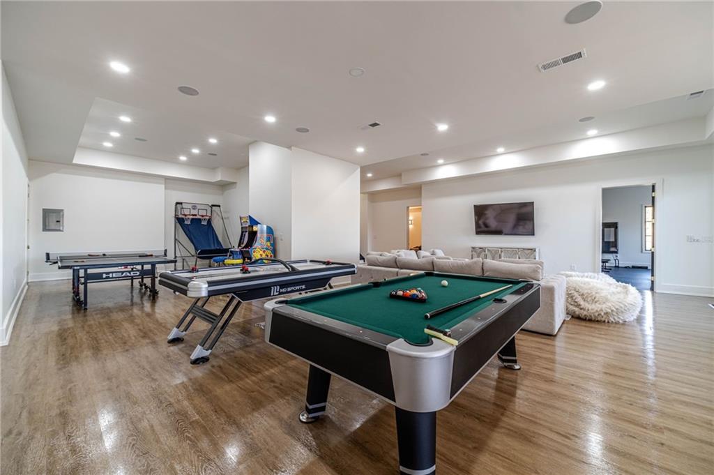 494 River Overlook Road Dawsonville, GA 30534 - Photo 53 of 90 a living room with furniture pool table and a rug