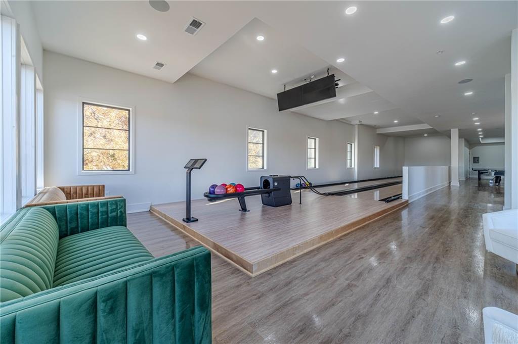494 River Overlook Road Dawsonville, GA 30534 - Photo 57 of 90 a living room with furniture and a wooden floor