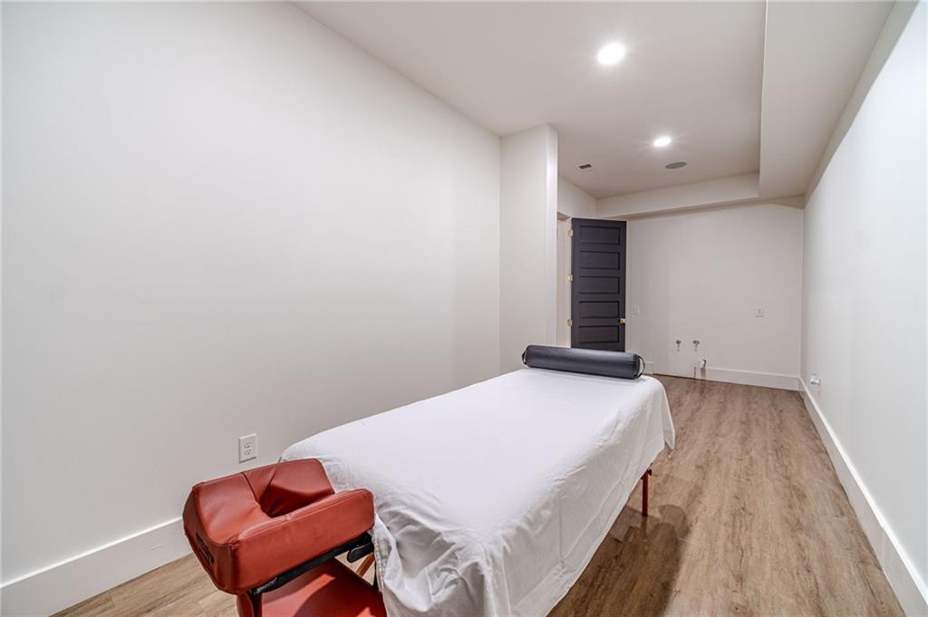 494 River Overlook Road Dawsonville, GA 30534 - Photo 64 of 90 a bedroom with a bed and wooden floor