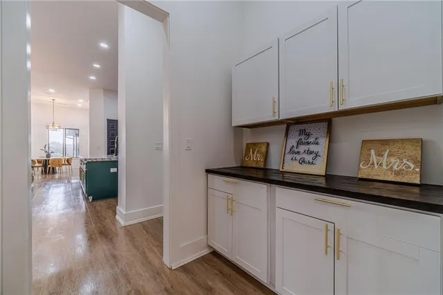 an open kitchen with a table and chairs