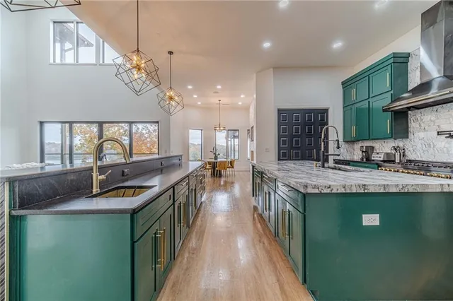 a view of a dining room with furniture and chandelier