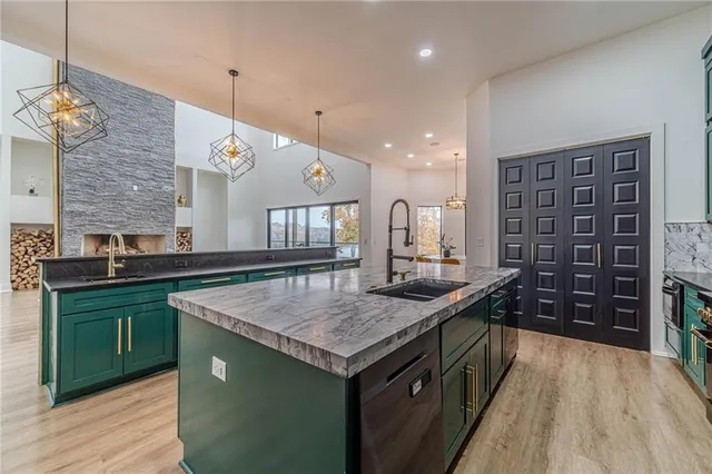a workspace with furniture wooden floor and a fireplace