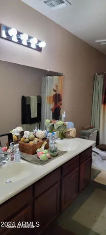 a room with a sink and cabinets