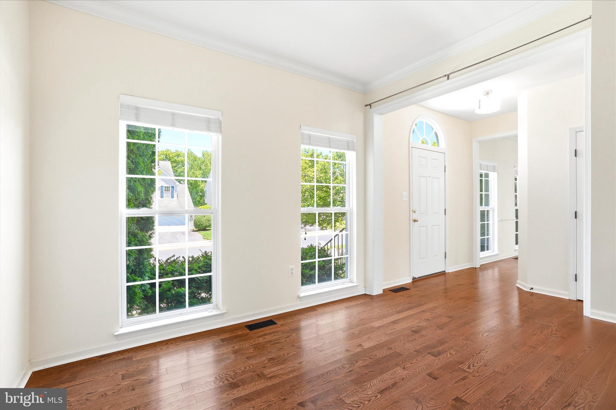 9009 Bealls Farm Road Frederick, MD 21704 - Photo 3 of 41 an empty room with wooden floor and windows