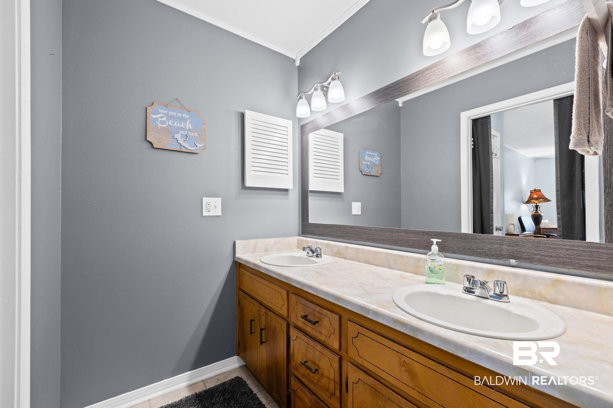 1437 Rio Circle Lillian, AL 36549 - Photo 17 of 46 Full bathroom featuring double vanity and baseboards