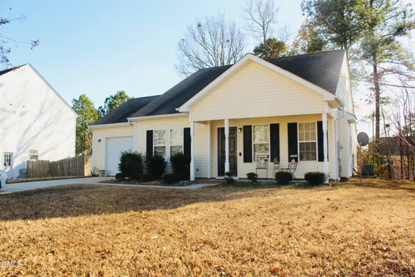 a front view of a house with a yard