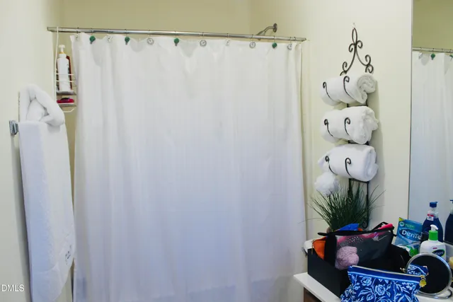 a bed room with a bed and a mirror