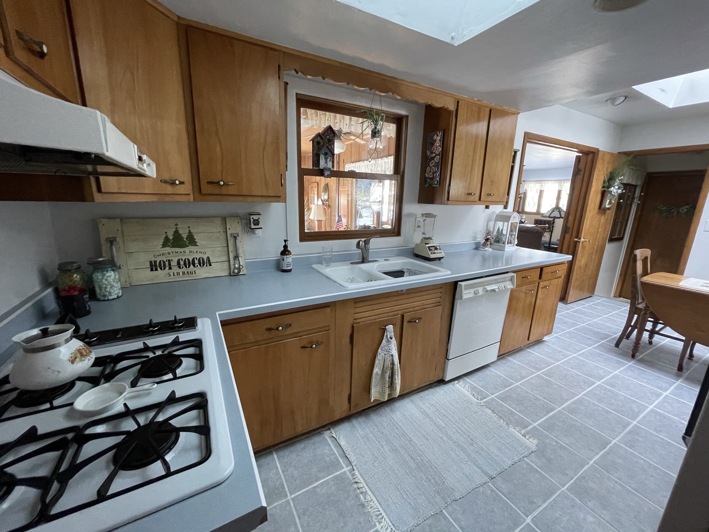 216 Pauline Drive Elgin, IL 60123 - Photo 8 of 20 a kitchen with stainless steel appliances a stove a sink and a refrigerator